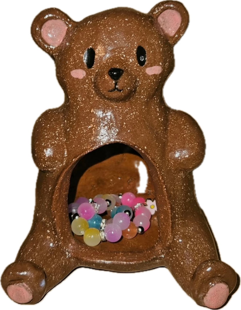 A brown ceramic bear